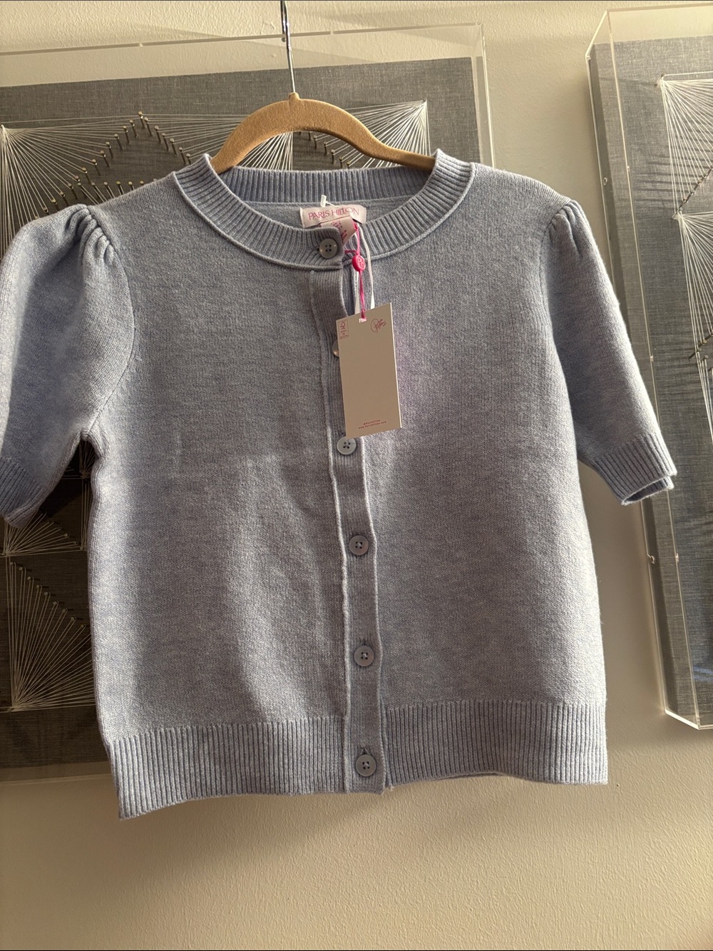 Paris Hilton sweater
New with tags 
Size S